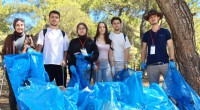 Kepez, öğrencilerle birlikte ormandaki çöpleri temizledi